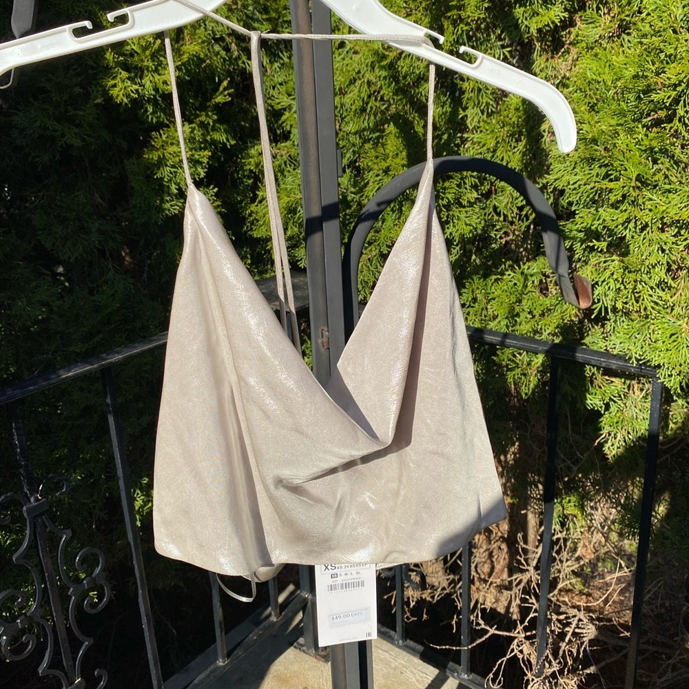 Zara dainty open back shiny top. Low cut front.